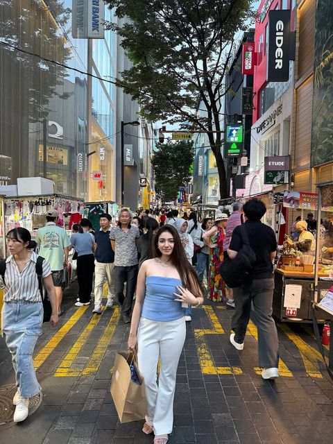 Shrestha Dutta shopping in Myeongdong district, Seoul, South Korea